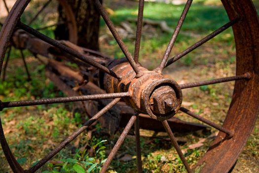 A rusty old wagon wheel
