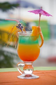 Colored cocktail with orange slice