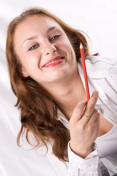 Beautiful girl posing with crayon. White background. #1