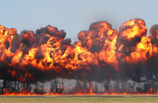 Giant Explosion! A wall of fire explodes on an open field. 