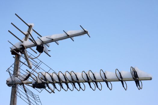 TV antenna covered with snow