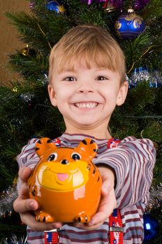 Six years boy with piggy bank and money