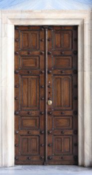 Antique side door of the metropolitan orthodox church in Athens, Greece