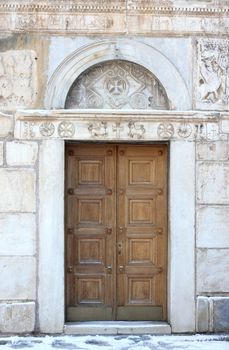 Antique door of St. Eleftherios orthodox church in Athens, Greece