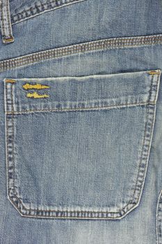 Blue jeans back pocket close up