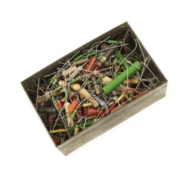 Box full of electronic resistors isolated in white