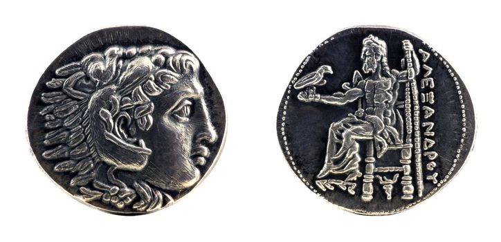 Greek silver tetradrachm from Alexander the Great showing Hercules wearing lion skin at obverse and Zeus at reverse, dated 323-315 BC.
