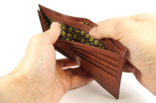 No money concept. Hands holding an empty leather wallet.