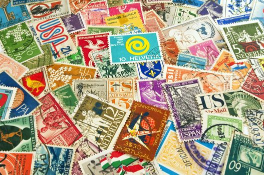 Assorted postage stamps from different countries around the world.