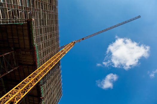Construction site with crane, copyspace.