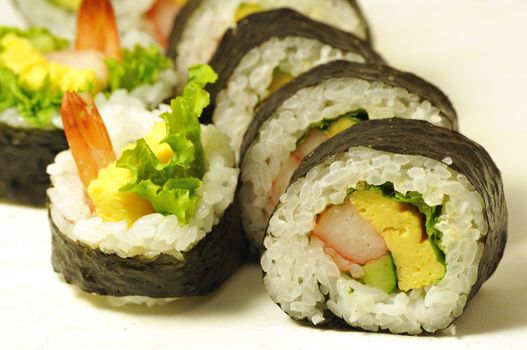close-up shot of traditional fresh japanese sushi rolls, focus on the front piece