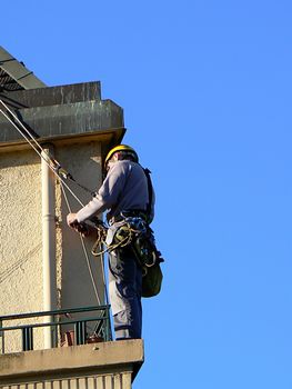 A man on the edge of a wall