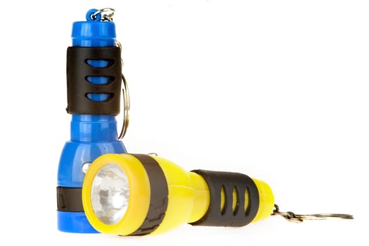 two colorful flashlights on white