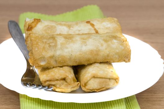 chinese spring rolls on a white plate