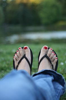 Beautiful red toe-nails, pedicure, woman feet