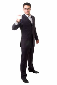 Young businessman holds an empty business card, isolated on white background.