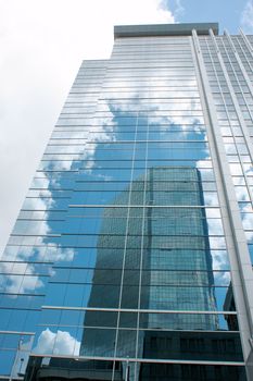 Downtown Toronto skyscraper with reflection of clouds and skyscraper