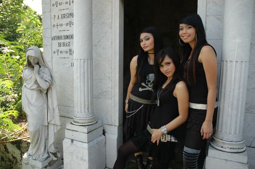 three asian ladies wearing nice and fashionable gothic suit
