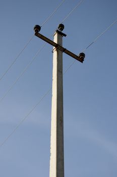 Electric power lines on a blue sky background Electrical tower on a background of the blue sky