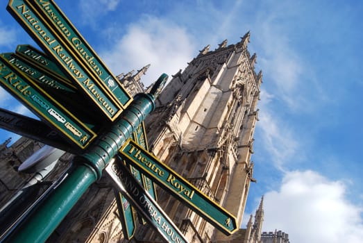 Closeup of tourist sign post outside of York Minster. York, North Yorkshire, UK.