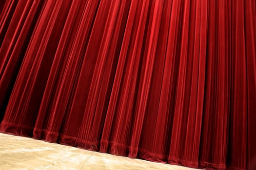 red velvet closed curtain, tilted photo, wooden floor