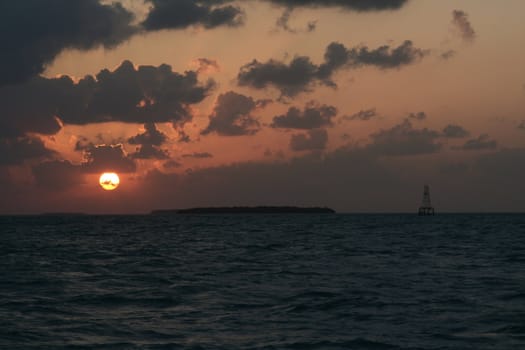 A dramatic sunset and the light and shadows from the clouds.