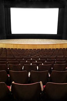 empty movie screen, black open curtain, wooden stage, wooden seats