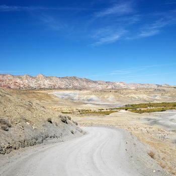 Gravel road in desert land of Cottonwood Canyon, Utah.