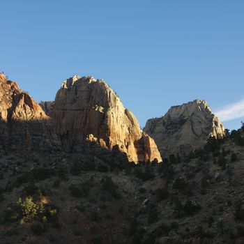 Rocky cliffs and rock formations in desert of Zion National Park, Utah.