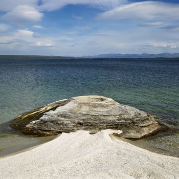 Geyser formation at water's edge in Yellowstone National Park, Wyoming.