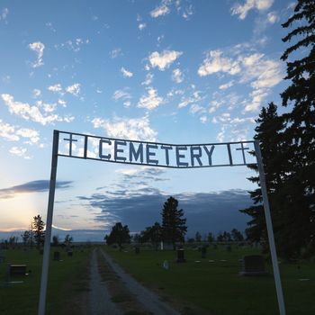 Sign over entrance to cemetary at dusk in rural South Dakota.