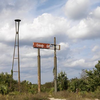 Old sign in rural setting.