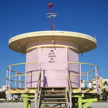 Pink art deco lifeguard tower closed up on beach in Miami, Florida, USA.