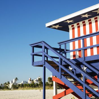 Lifeguard tower painted red, white and blue with stars and stripes on beach in Miami, Florida, USA.