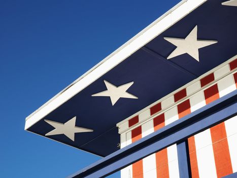 Close-up of lifeguard tower painted red, white and blue with stars and stripes in Miami, Florida, USA.