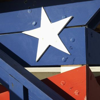 Close-up of lifeguard tower painted red, white and blue with stars and stripes in Miami, Florida, USA.