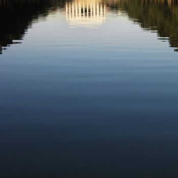 Lincoln Memorial reflected in water in Washington, D.C., USA.