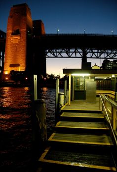wooden wharf and harbour bridge pillar, night shot