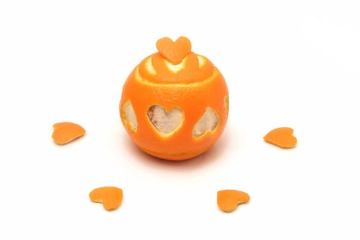 one fresh orange on white background, hearts cut from orange
