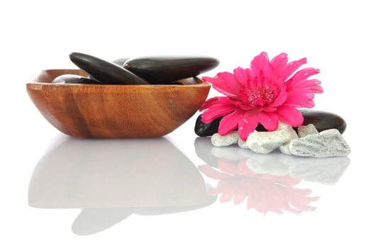 wellness zen and spa still life with flower towel and pebbles isolated on white