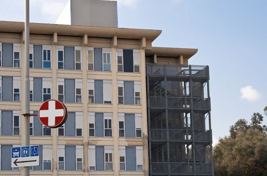 exterior of a modern hospital complex under a blue sky