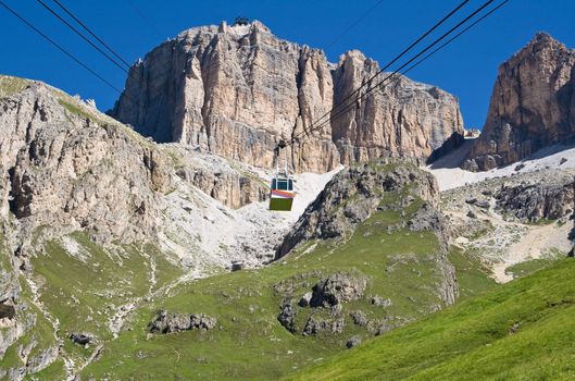 summer view of Saas Pordoi mountain with the characteristic cableway. Photo taken with polarized filter