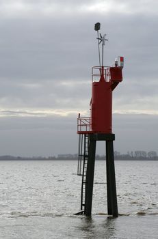 Backlit sea sign in river Elbe between Wischhafen and Glückstadt (near Hamburg/Germany).