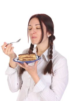 Beautiful woman eating piece of cake on white background