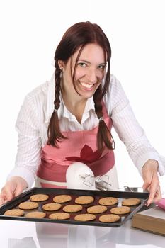 beautiful housewife showing off cakes on white background