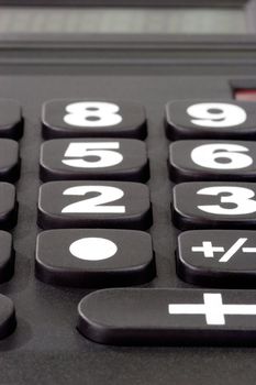 Close-up of a black solar desk calculator