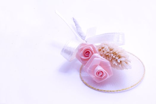 pink rose boutonniere, wedding flowers