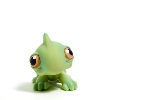 cute green dinosaur with big eyes, isolated on white