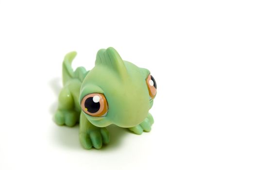 cute green dinosaur with big eyes, isolated on white