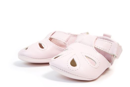 a pair of pink baby shoes